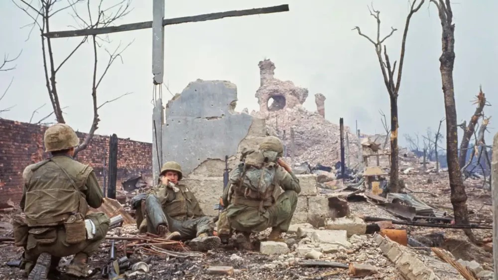 Myron Harrington uses a radio during the assault on Dong Ba tower during the Battle of Huế in 1968 image