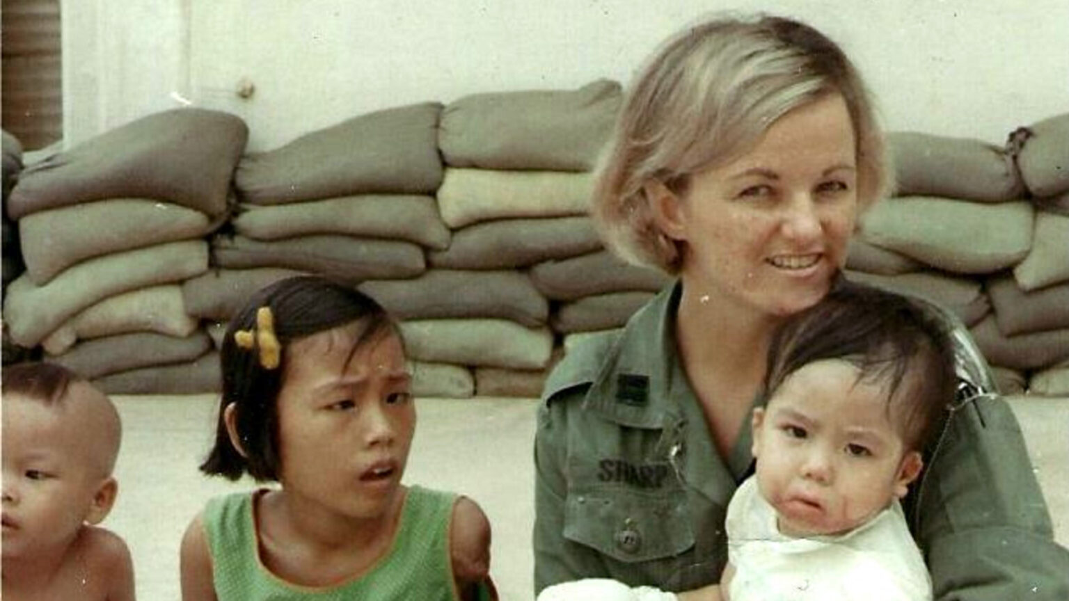 Capt. Linda Sharp with Vietnamese children image